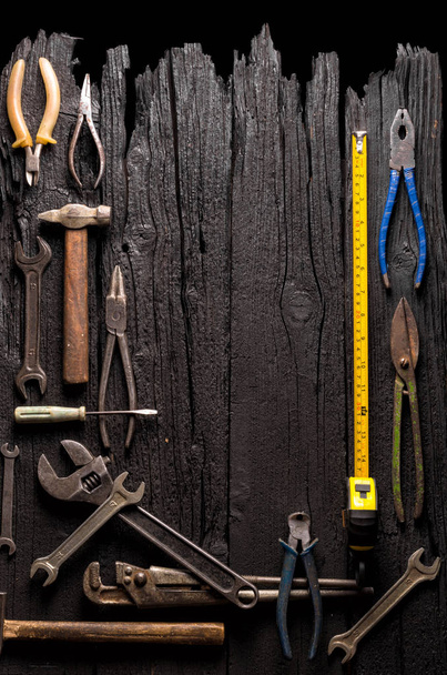 Many various tools against aged wooden background - Photo, image