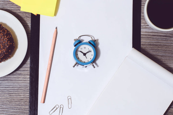 Cropped image of office accessories. Break at work, time for cof - 写真・画像