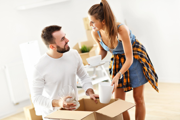 Happy adult couple moving out or in to new home - Photo, Image
