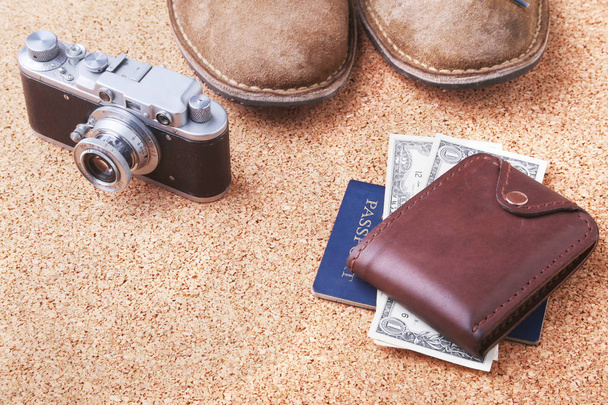 Set of mens accessories for the tourist on a white wooden background. The concept of fashion, leisure and travel. - Photo, image