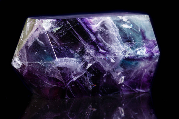 Macro mineral stone Fluorite crystal on a black background  - Photo, Image