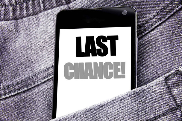 Hand writing text caption inspiration showing Last Chance. Business concept for Deadline Time Ending  written mobile cell phone with copy space in the back pants trousers pocket - Photo, Image