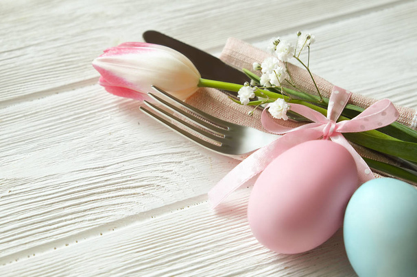 Easter laying table appointments, table setting options. Silverware, tableware items with festive decoration. Fork, knife and flowers. Happy easter holiday. - Fotoğraf, Görsel