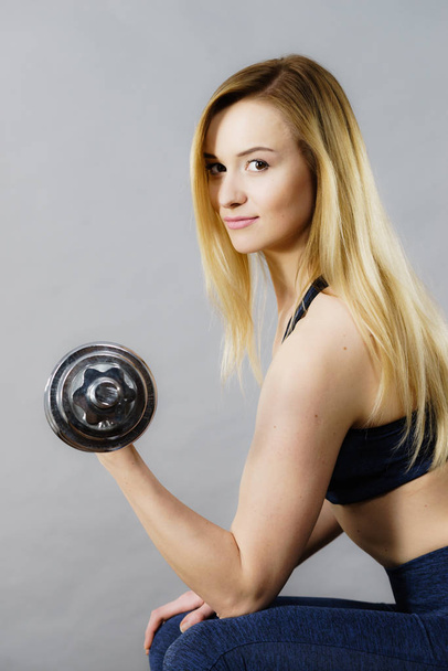 Fit woman lifting dumbbells weights - Photo, Image