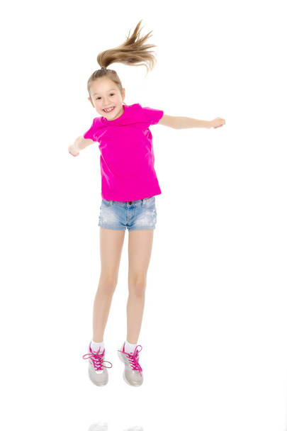 Girl gymnast jumping. - Фото, изображение