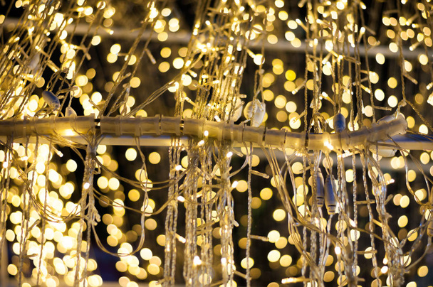 Gold bulb wire luxury bokeh blurred background in holiday party event - Φωτογραφία, εικόνα