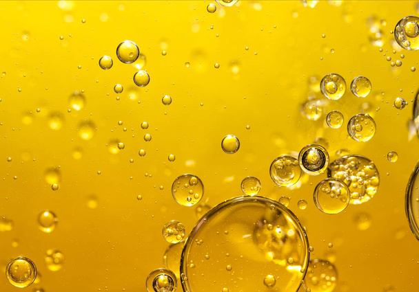 golden yellow bubble oil, abstract background - Foto, afbeelding