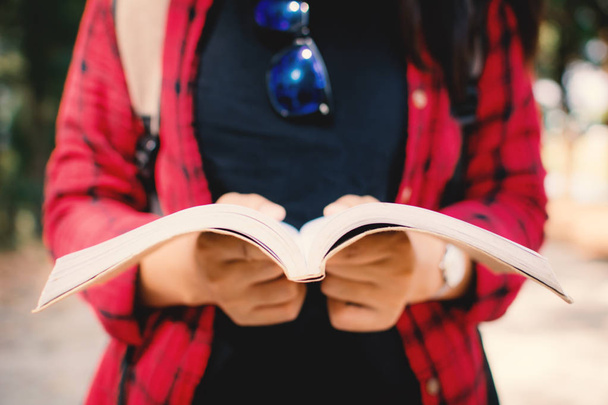 Close-up of woman holding a book ,soft focus - Fotografie, Obrázek