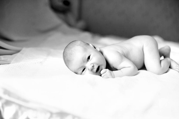 black-and-white photo in retro style.portrait of a newborn baby  - Zdjęcie, obraz
