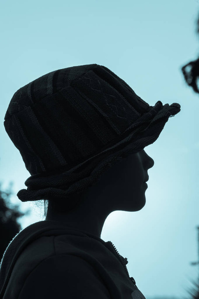 Girl Hat Closeup Profile Blue Silhouetted - Foto, afbeelding