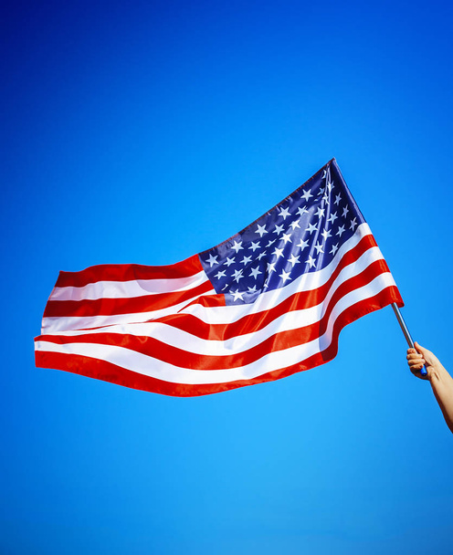 American flag holding in hand - Фото, зображення
