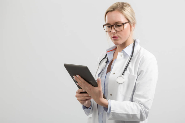 young female doctor with computer pad - Photo, Image