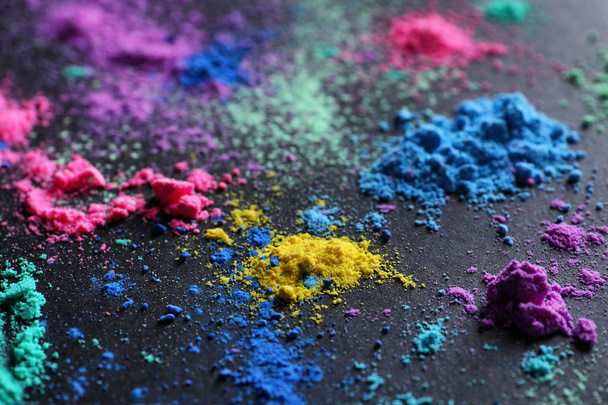 Colorful powders for Holi festival on dark background - Фото, зображення