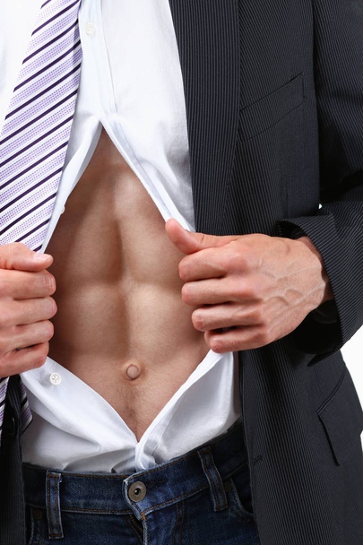 man in tie rip clothes off torso showing abs - 写真・画像
