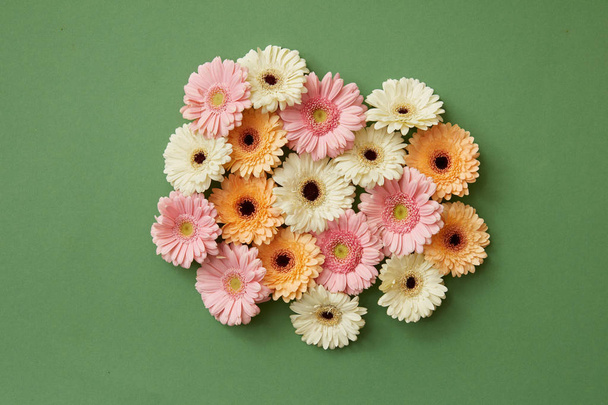 composition of fresh gerbera flowers on green background, Valentine day, Mother day, 8 March day card - Photo, Image