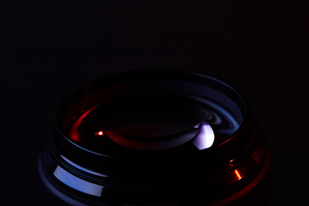reflecting optical lens on dark surface - Foto, Imagem