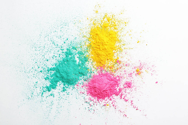 Colorful powders for Holi festival on white background - Foto, afbeelding