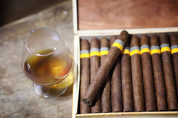 Large box of Cuban cigars on a wooden table - Photo, Image