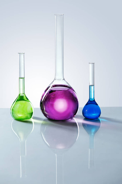 Laboratory Supplies. Colorful Glass With Chemical Liquids. - Фото, зображення
