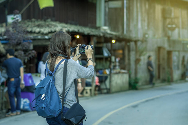 Backside of Asian traveler taking the photo in mae kam pong village, chiang mai, thailand, travel and lifestyle concept - Photo, image