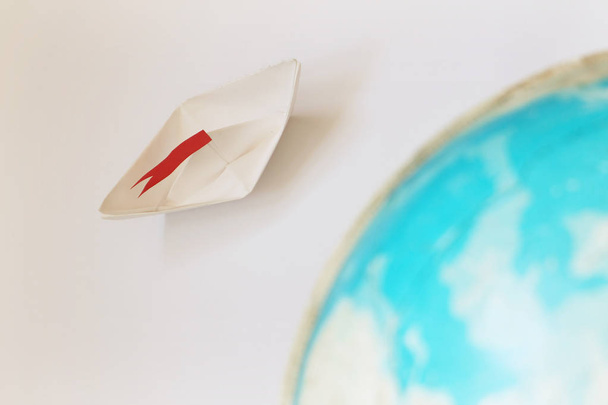 Travel concept with paper boat - 写真・画像