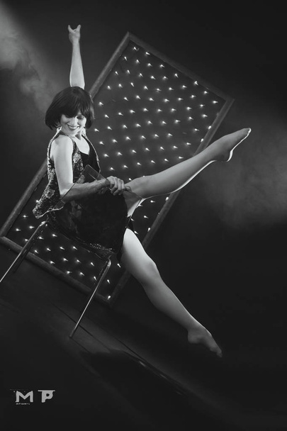  ballerina in a beautiful dress against the backdrop of lights - Foto, imagen