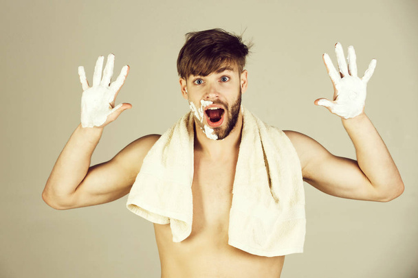 man rising hands with white shaving cream or foam - Фото, зображення
