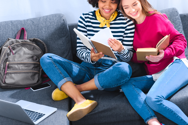 happy multicultural students studying together on sofa - Φωτογραφία, εικόνα