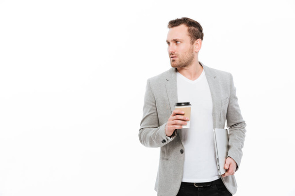 Handsome businessman drinking coffee. - Fotoğraf, Görsel