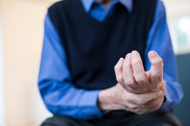 Close Up Of Senior Man At Home Suffering With Arthritis - Fotó, kép