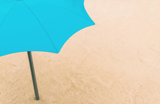 Minimalistic shot of a blue umbrella - Foto, Imagem