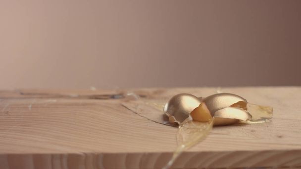mix of different eggs and the golden one on the first plane - 写真・画像