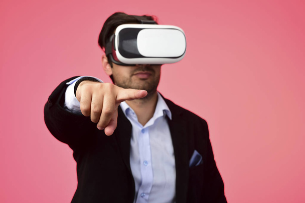 Arab Man experiencing virtual reality wearing virtual reality glasses - Photo, Image