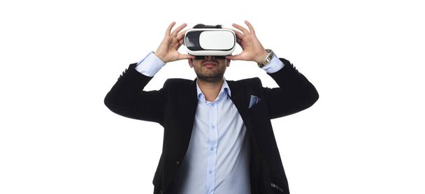 Arab Man experiencing virtual reality wearing virtual reality glasses - 写真・画像