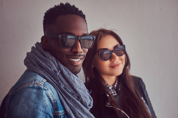 Portrait of an attractive stylish couple. An African-American man and Caucasian girl. - Photo, Image