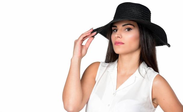 Woman in big black hat, studio portrait, isolated on white background - Foto, afbeelding