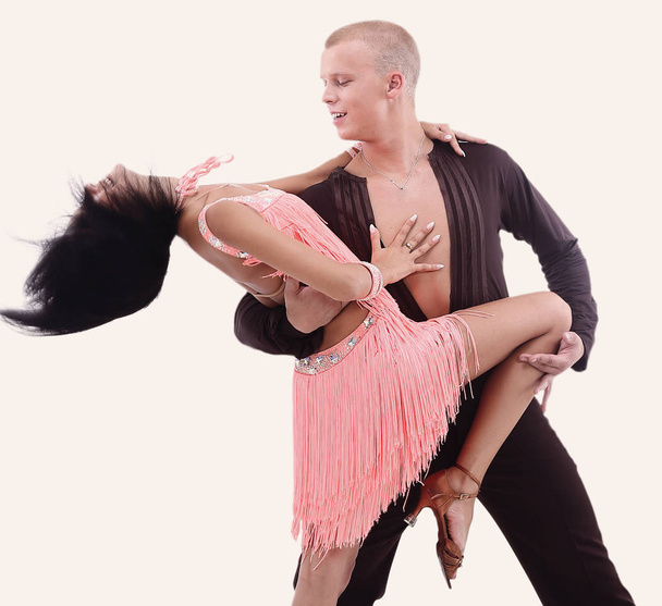 Beautiful ballroom couple performing their passionate exhibition - Photo, Image