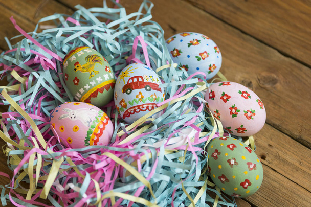 Easter colored eggs in the nest - Fotó, kép