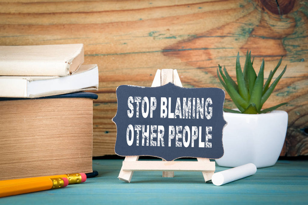 Stop blaming other people. small wooden board with chalk on the table - Photo, Image