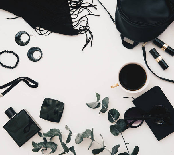 Flat lay feminine accessories collage with black dress, glasses, watch, mascara, lipstick, earrings on white background. - 写真・画像