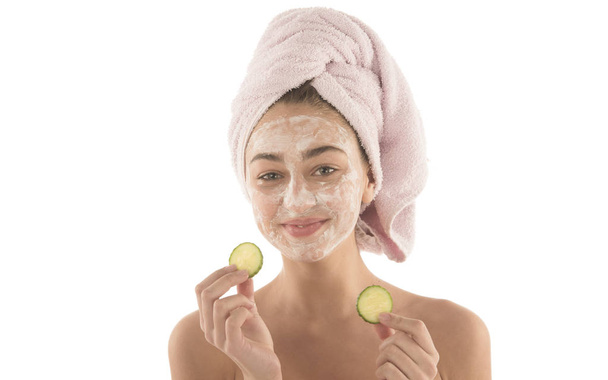 Beauty procedures skin care concept. Young woman applying facial mud clay mask to her face - Φωτογραφία, εικόνα