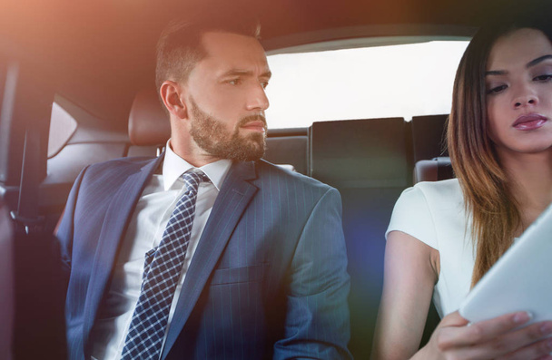 successful people working together in back seat of car - 写真・画像
