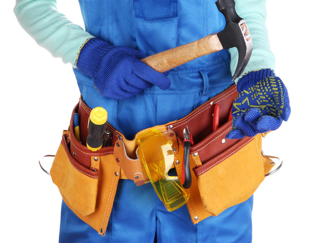 Male builder in blue overalls with gavel isolated on white - Foto, Bild