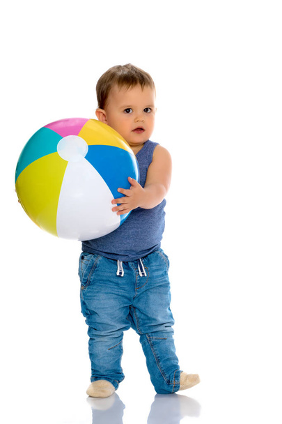 A little boy is playing with a ball. - Photo, Image
