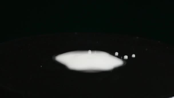 milk On Moving Subwoofer on black background - Πλάνα, βίντεο