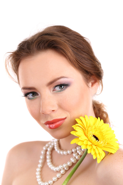 Beautiful young woman with bright make-up, holding flower, isolated on white - Foto, Imagem
