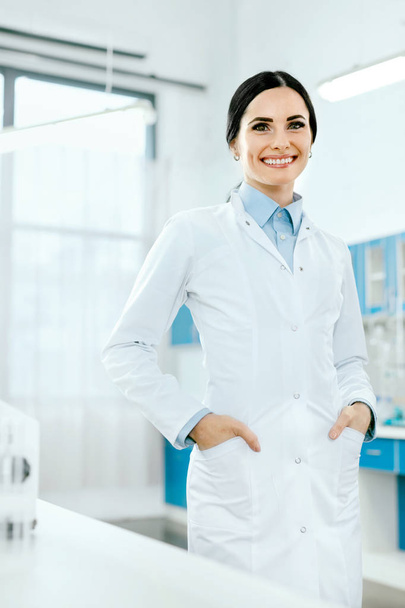 Scientist In Laboratory. Female Doctor At Work - Фото, изображение