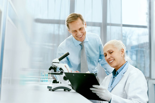 Scientific Team Working In Modern Laboratory. - Photo, Image