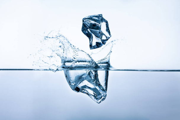 Ice cubes splashing into clear water - Photo, Image