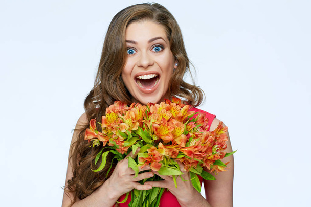 beautiful surprised woman holding flowers bouquet, spring concept  - 写真・画像
